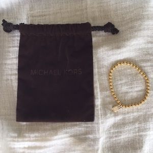 Michael Kors gold stretchy lock bracelet